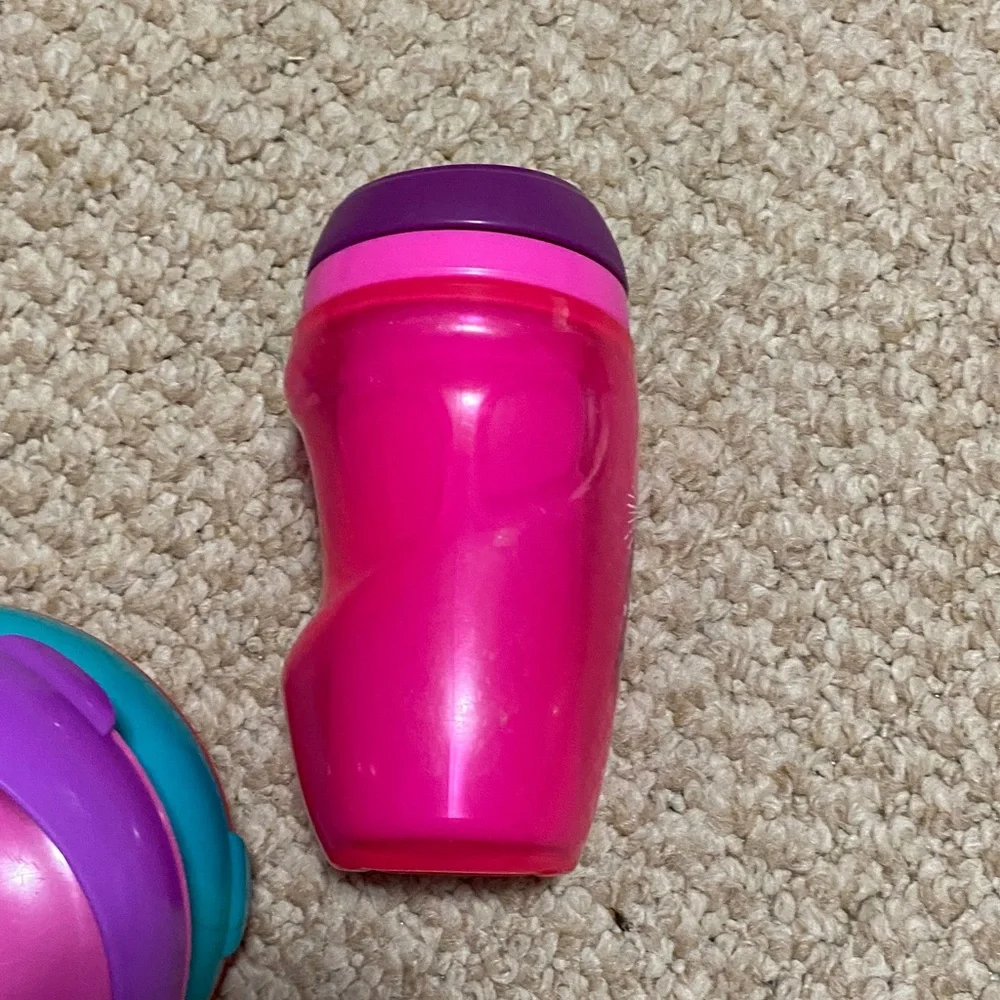 2 bibs, green & blue, 2 suction bowls, pink & purple, 1 tommie tippie sippie cup